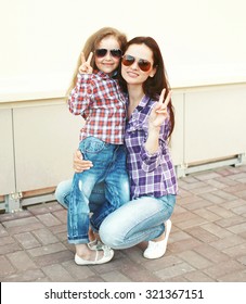 Portrait Cool Mother And Child Wearing A Checkered Shirts And Sunglasses Having Fun Together