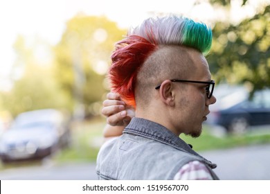 Portrait Of A Cool Young Man With Pink Mohawk
