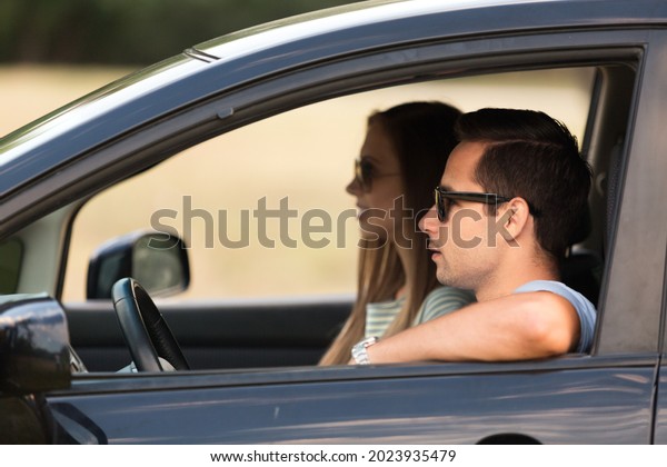 Portrait of a Couple in a\
Car