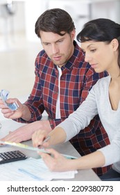 Portrait Of Couple Counting Money