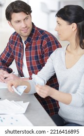 Portrait Of Couple Counting Money