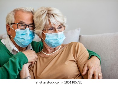 Portrait Of Couple Elder Senior Old Male And Female Wearing Face Medical Mask. Pandemic Coronavirus Disease Quarantine In Home. Covid-19 Outbreak Prevention Concept.