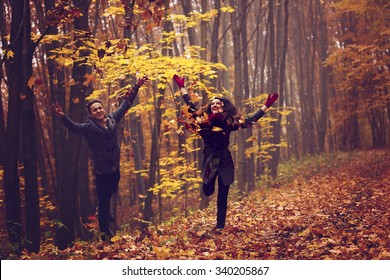 Portrait Of Couple Enjoying Golden Autumn Fall Season