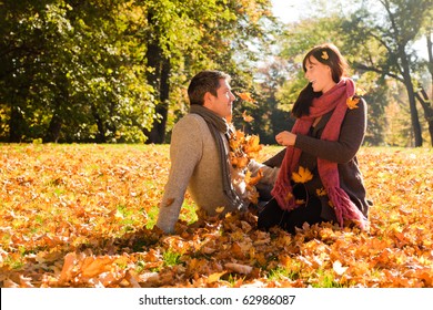 Portrait Of Couple Enjoying Golden Autumn Fall Season