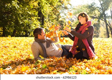 Portrait Of Couple Enjoying Golden Autumn Fall Season