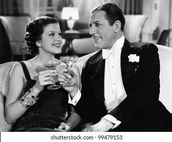 Portrait of couple having drinks - Powered by Shutterstock