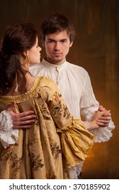  Portrait Of Couple In Historical Costumes On Dark Background