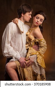  Portrait Of Couple In Historical Costumes On Dark Background