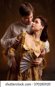  Portrait Of Couple In Historical Costumes On Dark Background