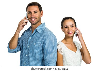 Portrait Of Couple On Phone Call Looking At The Camera On White Screen