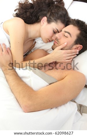 Similar – Man looking to beautiful woman lying on bed