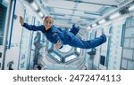 Portrait of a Courageous Caucasian Female Astronaut on Board a Spacecraft, Floating in Zero Gravity and Smiling At The Camera, Waving. Space Travel, Solar System Exploration and Colonization.