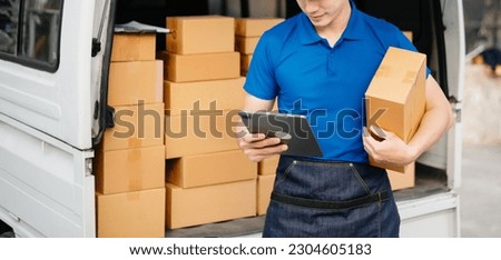 Portrait of courier delivery man searching the address on digital tablet. Delivery service, delivery home and shipping concept.

