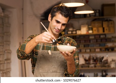 Portrait Of Craftman In Workshop