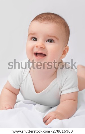 Portrait of 3 month old baby smiling.