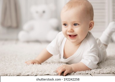 Portrait of a crawling baby on the carpet in my room