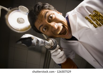 Portrait Of Crazy Dentist With Drill