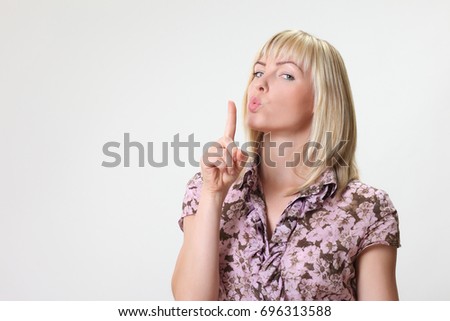 Portrait of crazy funny woman On a gray background