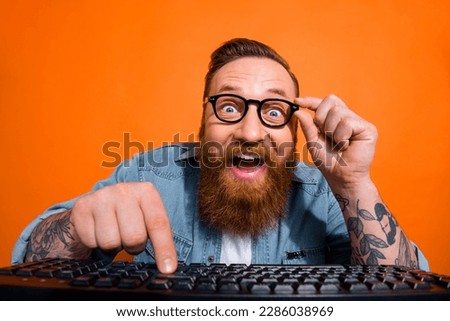 Portrait of crazy geek developer using computer coding searching web shopping sales isolated on shine color background