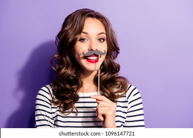 Portrait of crazy trendy chic with beaming smile having carton paper black cutout mustache on stick looking at camera isolated on violet background - Powered by Shutterstock