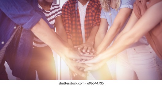 Portrait Of Creative Business Team Stacking Hands In Office