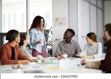 Portrait of creative multi-ethnic team collaborating on project during meeting in office, copy space - Powered by Shutterstock