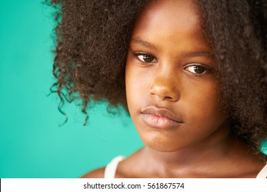 Portrait Of Cuban Children With Emotions And Feelings. Black Young Girl From Havana, Cuba Looking Away With Worried Face, Female Child With Sad Expression.