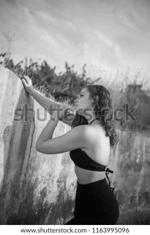 Similar – Image, Stock Photo Smiling brunette girl holding surfboard over her head