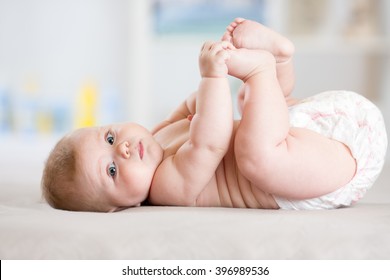 Portrait Of A Cute 5 Months Baby Lying Down On A Blanket