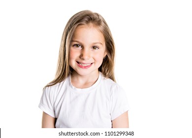 Portrait Of A Cute 7 Years Old Girl Isolated Over White Background