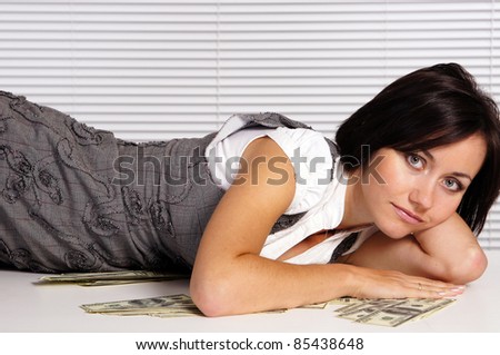 portrait of a cute adult girl with money