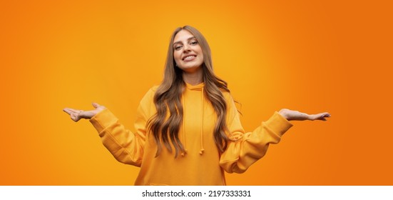 Portrait Of Cute Attractive Young Woman Showing Whatever Gesture On Yellow Background