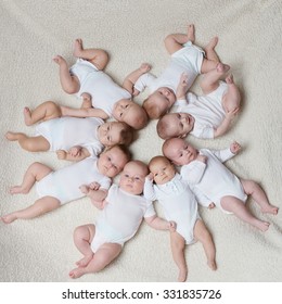 Portrait Of Cute Babies On Light Background