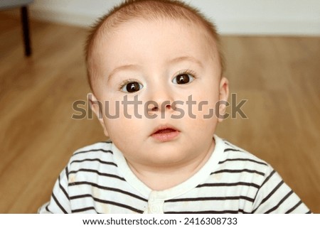 Similar – Der kleine Junge im Schlafzimmer im Bett.