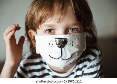 Portrait Of A Cute Boy In A Funny Medical Mask.