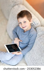 Portrait of cute boy with iPad