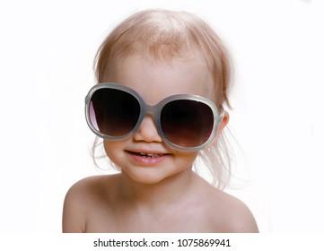 Portrait Of Cute Caucasian Baby 2-3 Year Old With Big Sunglasses On Face. Isolated On White Background