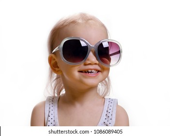 Portrait Of Cute Caucasian Baby 2-3 Year Old With Big Sunglasses On Face. Isolated On White Background