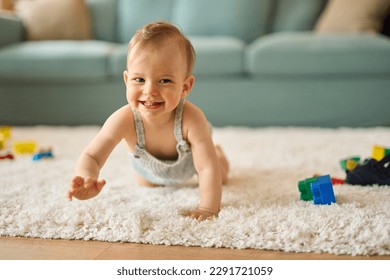 Portrait of a cute crawling baby boy smiling at the camera - Powered by Shutterstock