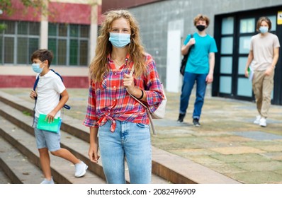 Portrait Of Cute Girl Teen Student In Protective Face Mask On Her Way To College Outdoor