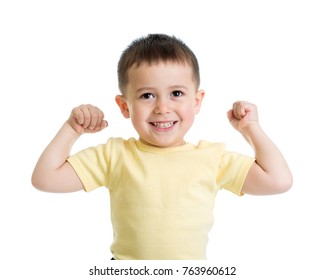 Portrait Of Cute Kid Boy Showing The Muscles Of His Arms, Isolated On White