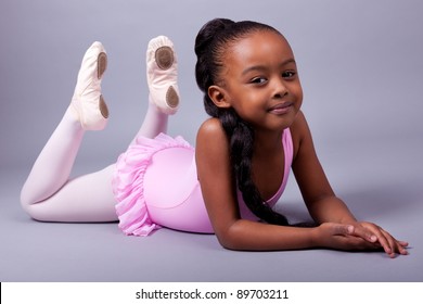 Portrait of a cute little African American girl wearing a ballet costume