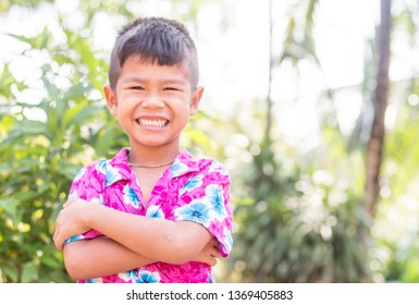 Portrait Of A Cute Little Asain Boy Smiling.