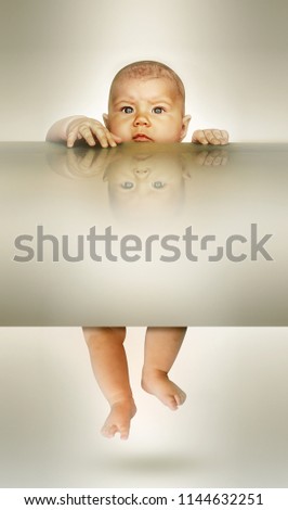 Similar – Baby girl four months old having her bath