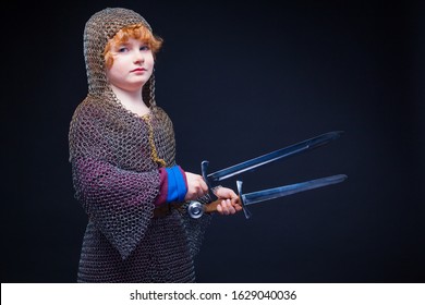 Portrait Of A Cute Little Boy Dressed As A Medieval Knight With A Sword. Kid Medieval Warrior, Baby In Knight Costume. Medieval Festival Or Costume Party For Kids.