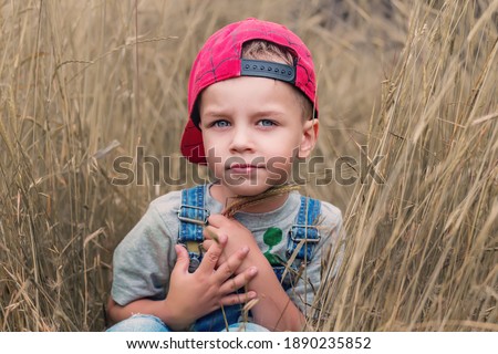 Portrait of a cute little boy on a walk