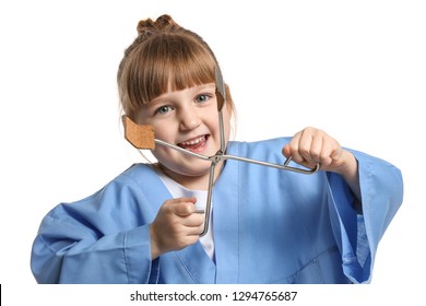 Portrait of cute little doctor on white background