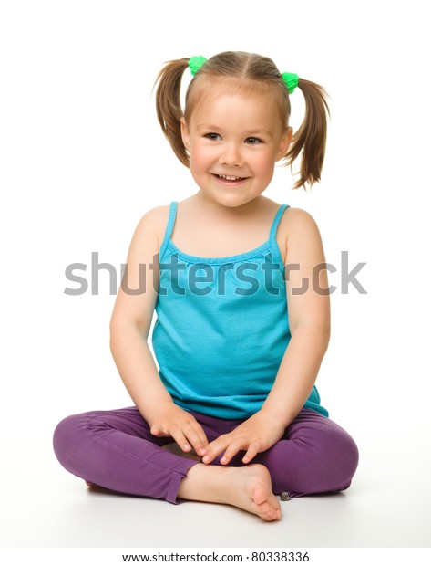 Portrait Of Little Beautiful Girl Sitting Isolated On White Stock Photo