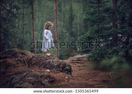 Similar – Image, Stock Photo Young woman with hat taking a walk in the deep forest at sunset.