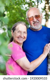 Portrait of cute older men and women in  birch  grove